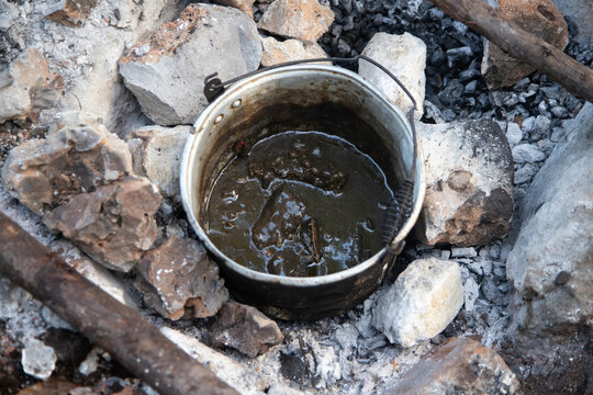 Cooking relleno negro in a pib, an ancestral Mayo method of cooking in the ground used on the Yucatan Peninsula.