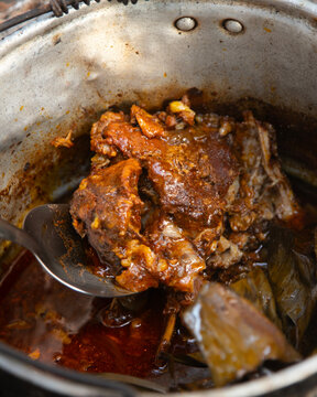 Cooking cochinita pibil. The pib is an earth oven typical of the Yucat&aacute;n Peninsula in Mexico. This pre-Hispanic technique involves digging a pit, lighting a fire with wood and stones, and cooking the 