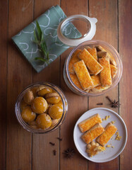 Top view of traditional Eid cookies in glass jars