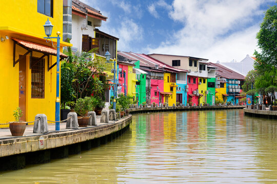 Colorful old houses converted into restaurants or shops along the Malacca or Melaka river riverfront, Malacca, Malaysia