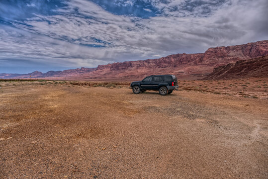 Vehicle parked next to Jackass Creek off of US89A near Echo Cliffs on the way to Vermilion Cliffs Arizona. Located on the Navajo Indian Reservation between Bitter Springs and Marble Canyon.