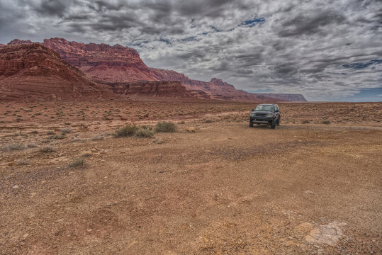 Vehicle parked next to Jackass Creek off of US89A near Echo Cliffs on the way to Vermilion Cliffs Arizona. Located on the Navajo Indian Reservation between Bitter Springs and Marble Canyon.