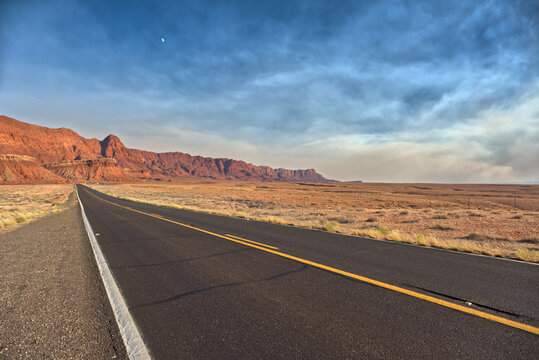 Echo Cliffs near Marble Canyon Arizona near sunset with smoke in the sky from the Dragon Bravo Wildfire, United States