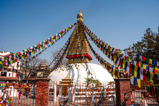Small white stupa adorned with prayer flags at Charumati Stupa a peaceful Buddhist site nestled in Kathmandu&acirc;&euro;&scaron;Ă&bdquo;Ă&acute;s city center