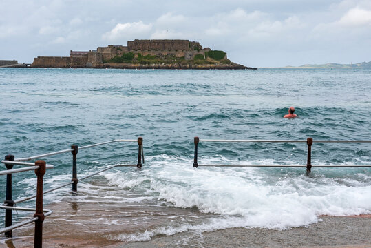 La Vallette Bathing Pools with Castle Cornet in the background, St Peter Port, Guernsey Island, Bailiwick of Guernsey, United Kingdom