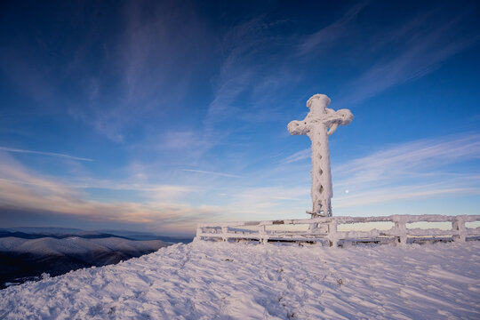 Snow covered mountain trail on Tarnica during a cold and frosty winter day in the Polish Bieszczady.
