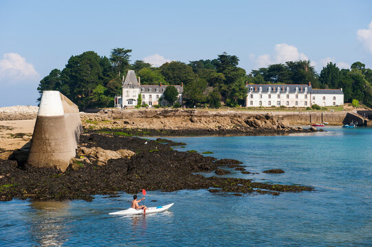 Kayak in front of Tristan Island off Douarnenez, Finistere department, Brittany region, France