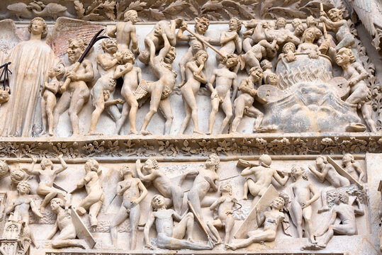 The punishment of sinners depicted on the Tympanum over the Central portal of the west facade, Saint Stephen Cathedral, Bourges, France