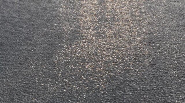 Reflections of the sun on a lake.