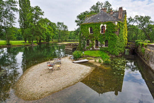 Former watermill on the Indre River bank, converted into a coffe-shop at the French Renaissance Chateau de l'Islette, France