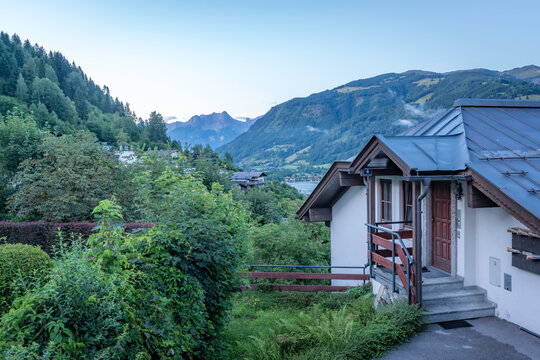 View of chalet in Zell am See and mountains in backgroundd during golden hour, Zell am See, Salzburg, Austria, Europe