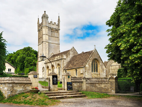 St Mary The Virgin Church stands in Westwood Wiltshire surrounded by trees and open sky, showcasing its historical architecture and setting