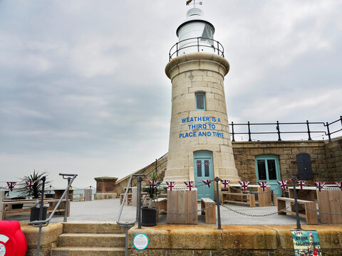 Folkestone Harbour Arm Lighthouse stands as a landmark on the coast in Kent while inviting visitors to explore and enjoy the area