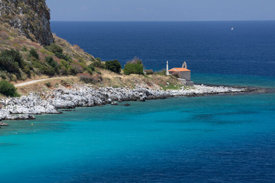 Chapel on headland with turquoise water, Limeni, Mani, Peloponnese, Greece, Europe