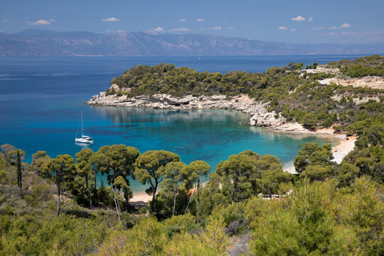 Agia Paraskevi beach with yacht anchored in bay, Spetses, Saronic Islands, Greek Islands, Greece, Europe