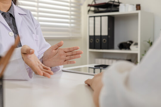 Doctor counseling, elderly woman aging wellness healthcare, symptom clarification, diagnosis hypertention concern, referral decision, follow up schedule, appointment management, patient centered care