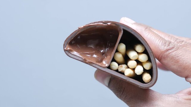 Chocolate spread dip for biscuit sticks sweet snack dessert treat in hand