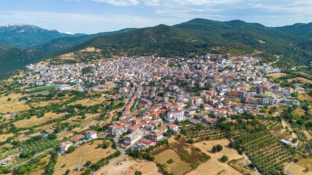 Aerial view of the historic village of Orgosolo nestled in the Supramonte mountains in the heart of Barbagia, Sardinia, Italy
