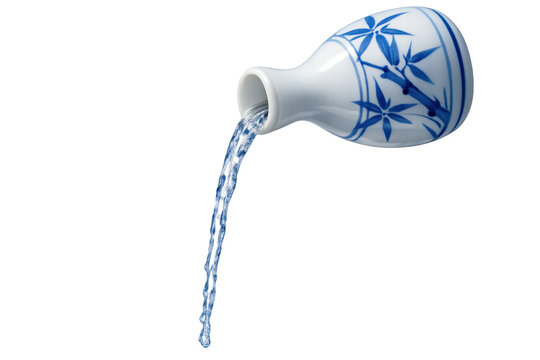 Traditional Japanese sake bottle pouring clear liquid