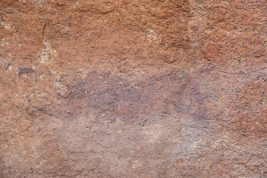 Prehistoric rock art on a red rock wall, Spitzkoppe, Namibia