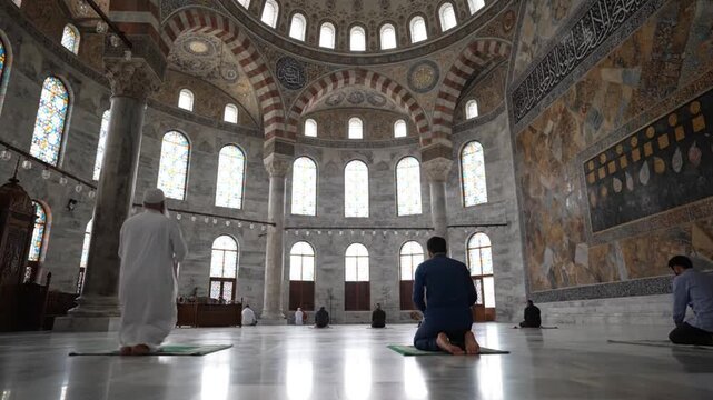 Men Praying in a Grand Mosque Interior.