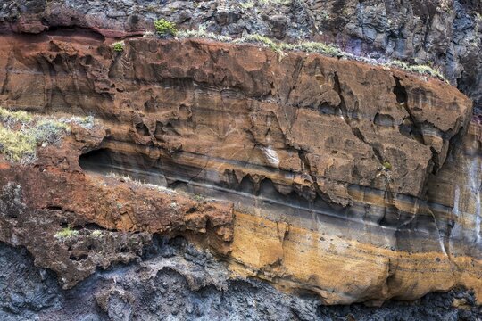 Weathered lava rocks on the cliffs near Paul do Mar, Madeira, Portugal