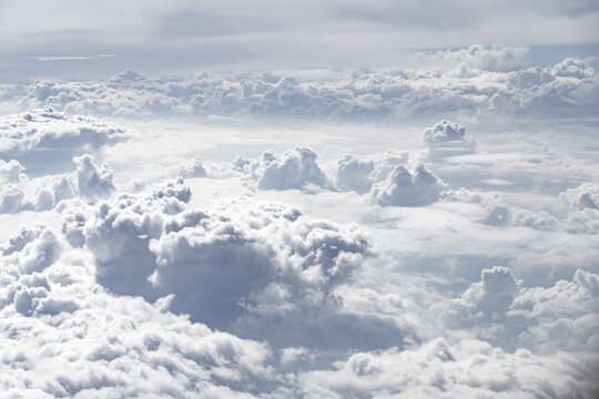View over towering clouds, cloudy sky, aerial view from the plane