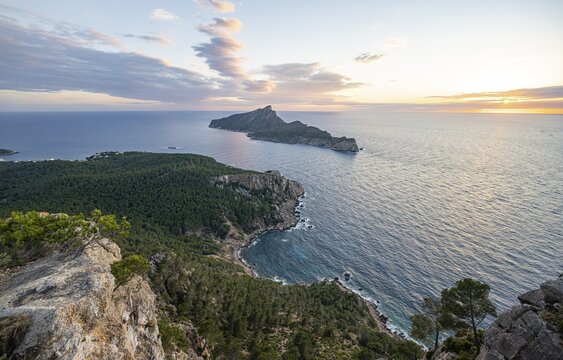 View of mountains and coast with sea, at sunset, walking to La Trapa from Sant Elm, back island of Sa Dragonera, Serra de Tramuntana, Majorca, Spain