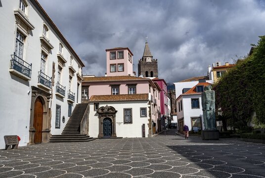 Small square in the old town with colourful houses and chapel Capela de Santo Antonio de Mouraria, tower of the church S&eacute; do Funchal in the back, Funchal, Madeira, Portugal