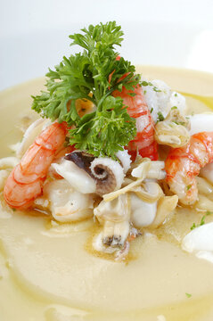 Crema di fave con polipetti e gamberetti or cream of broad beans with octopus and shrimp is a typical food from Puglia region in Italy