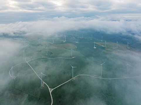 Windmills on a wind farm near Zahara de los Atunes, at a cloudy morning, aerial view, drone shot, C&aacute;diz province, Andalusia, Spain