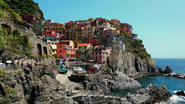 Riomaggiore Cinque Terre Aerial Drone Pan Over Cliffside Village Harbour Italy 4K Summer