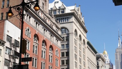 Obraz premium New York City Midtown urban buildings architecture, Manhattan street, 5 fifth avenue, United States of America. Red brick classic house, USA. Typical old historic real estate property in NYC. Lantern.