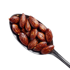 Obraz premium PNG of Close-up of roasted almonds on a silver spoon, highlighting their rich texture and color.