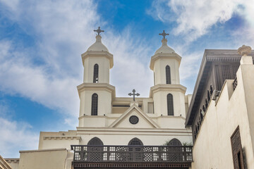 Famous hanging church in Coptic Cairo with twin towers and crosses showcasing Coptic architecture