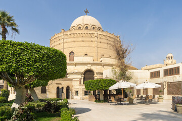 Historic church St. George in Coptic Cairo with domed sanctuary and urban surrounding buildings