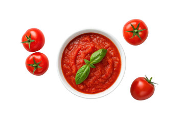 Fototapeta premium A bowl of tomato sauce with fresh basil and tomatoes