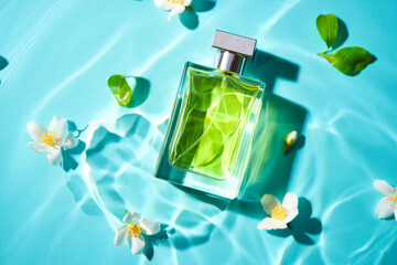 Bottle of cologne is floating on top of a blue body of water