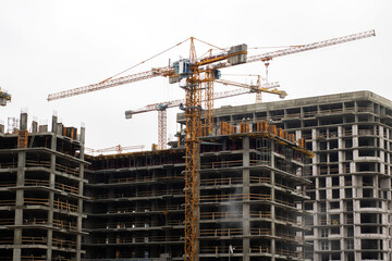 Imposing cranes dominate horizon as urban development advances rapidly with new structures