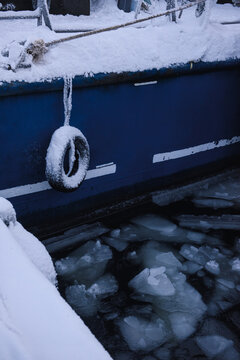 Close-up of a frozen ice covered lifebuoy hanging on the side of a boat in the Barents Sea, Murmansk, Russia