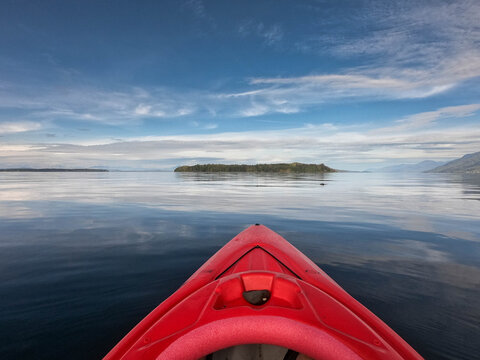 Close-up of the front of a red kayak in the ocean, Alert Bay, Cormorant Island, British Columbia, Canada