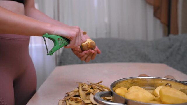 Preparing potatoes for family meal. Peeling and organizing potatoes for dinner preparation. Meticulously peeling and arranging potatoes in preparation for communal family dinner