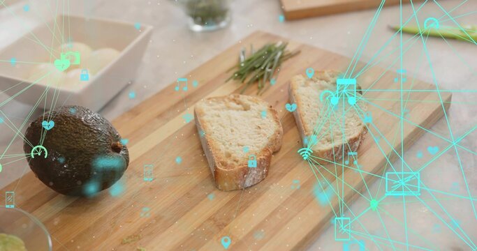 Displaying wooden board with rustic bread, avocado, rosemary, crumbs on stone counter, teal overlay