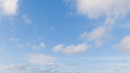 Deep Blue Sky with Soft White Clouds and Clean Atmospheric Background