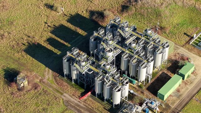 Tertiary treatment aerial view of chemical dosing silos and mechanical filtration units at Luton sewage works UK for water purification.