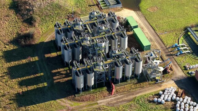 Tertiary treatment aerial view of chemical dosing silos and mechanical filtration units at Luton sewage works UK for water purification.