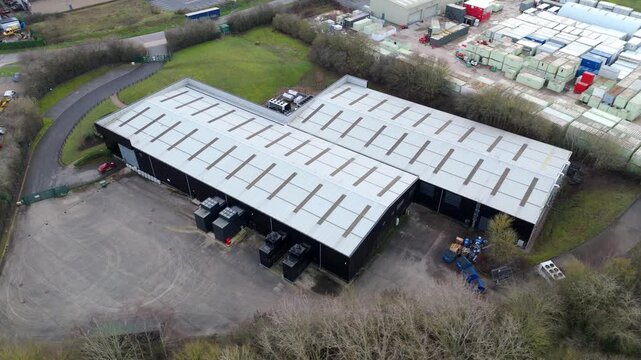 Aerial drone view of a small-scale data centre in Northampton, UK, dedicated to critical AI infrastructure and secure cloud computing.
