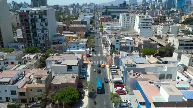 Cinematic aerial traveling over sunny and peaceful tourist streets of Miraflores, Lima, Peru in 4K 60fps drone footage.