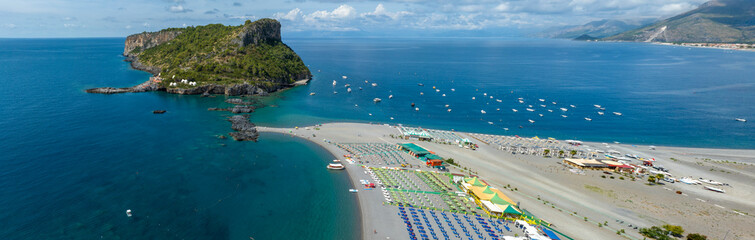 Obraz premium Aerial view of the Dino Island connected by a narrow channel to the expansive Praia a Mare coastline, located in the province of Cosenza, Calabria, southern Italy. It is a beautiful natural attraction