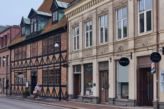 Helsingborg, Sweden - 12 August 2025: View of the street's historic buildings, where brick and timber facades stand in harmony, reflecting the city's architectural heritage.